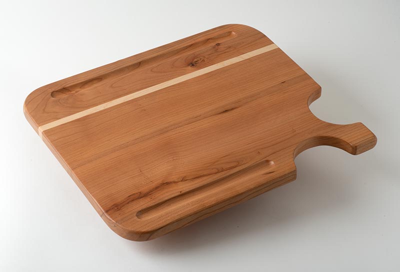 Charcuterie board, in cherry with corner handle